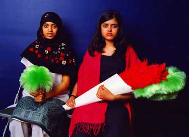 Two girls with feather duster bouquets