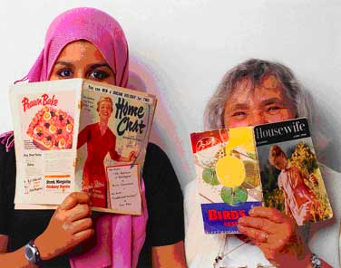 Picture of two women looking over magazines